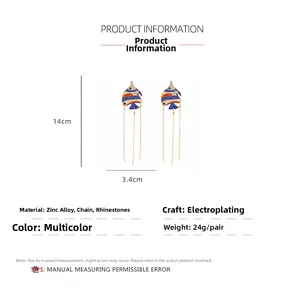 Detailed view of enamel fish tassel earrings with rhinestones showing 14cm length dimensions