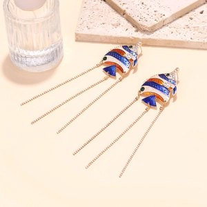 Detail of tropical fish enamel earrings with long sparkling rhinestone tassels and gold trim