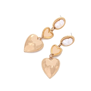 Detail of multi-layer heart earrings with baroque pearls and gold textured finish
