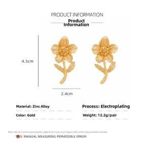 Detail view showing golden alloy floral earrings with dimensions of 4.5cm height and 2.4cm width