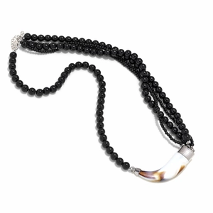Multilayer black beaded necklace featuring a vintage style faux horn pendant design