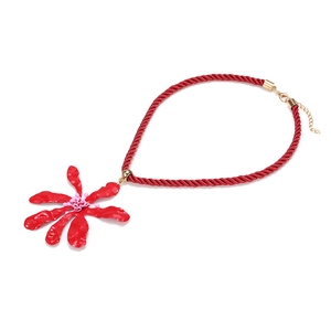 Bohemian large red flower pendant necklace with woven cord and golden clasp on white background