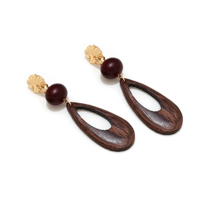 Retro hollow wood teardrop earrings with golden metal leaf and dark red bead details