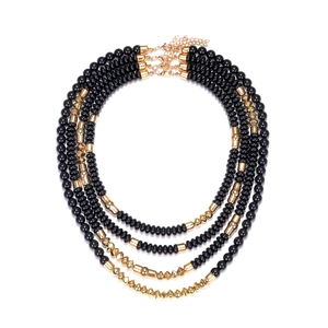Layered chunky black and gold beaded waterfall necklace set with metallic spacers