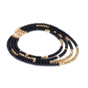 Detailed view of multilayer beaded necklace with black and gold beads and lobster clasp