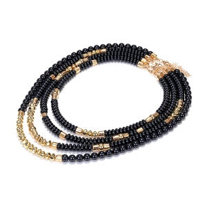Close-up of multilayer handmade beaded necklace with golden lobster clasp and extender