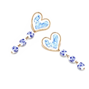 Blue heart enamel earrings with white floral ceramic beads and golden finish details