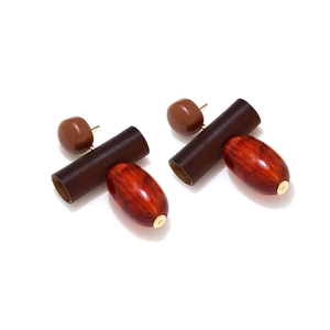Retro geometric drop earrings with wood beads and amber resin pendants on white background