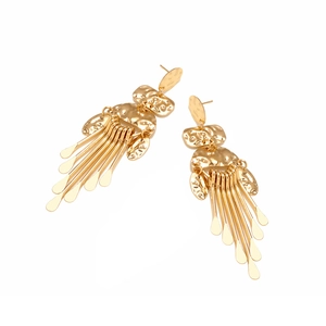 Detail of golden tassel drop earrings with vintage hammered texture and droplet ends