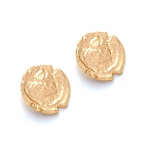 Detailed view of vintage gold coin earrings with hammered texture and embossed heart