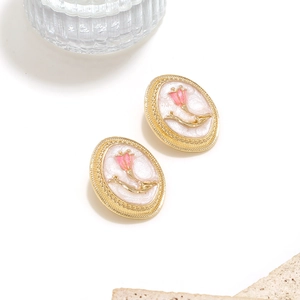 Retro gold tulip earrings with white enamel finish and pink floral accents for women