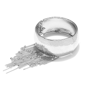 Silver hammered metal cuff bracelet featuring long chain tassels and bead accents