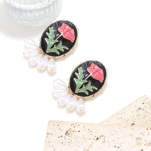 Vintage enamel rose earrings with red flowers and five teardrop pearls on white background