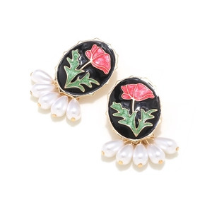 Vintage enamel rose earrings with pearls and black background in gold-tone setting