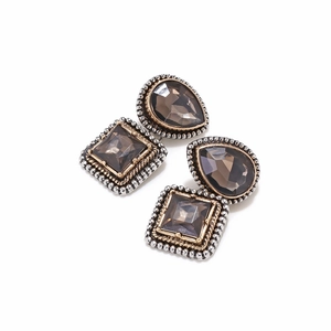Detailed view of vintage alloy geometric earrings with brown glass stones and retro beads