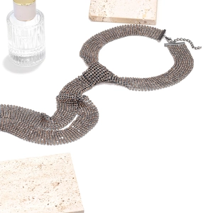 Detail of rhinestone mesh necklace in champagne gold with lobster clasp and chain