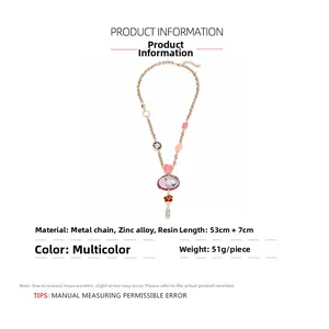 Ethnic style necklace detail showing floral ceramic pendant and zinc alloy resin specs