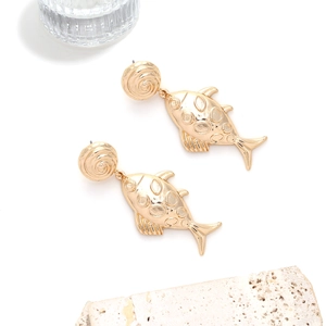 Detailed view of long gold alloy fish earrings with textured spiral studs and fish charms