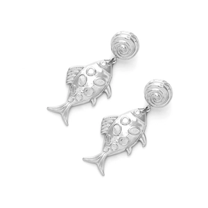 Macro detail of polished silver fish earrings with textured scales and spiral discs