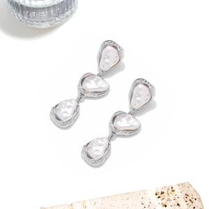 Baroque pearl drop earrings with triple tiered irregular pearls and silver metal frame