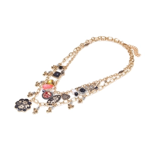Vintage gold-tone layered chain necklace featuring enamel floral and heart charms
