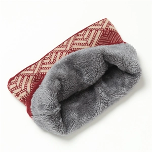 Detail of red and beige knitted winter neck warmer with thick grey faux fur lining