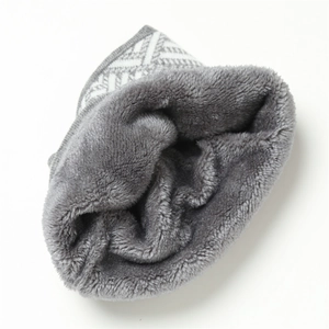 Detail of winter neck warmer showing thick faux fur lining and knitted fabric