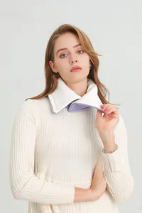 Detail of white plush neck warmer with soft light purple fleece lining and button closure