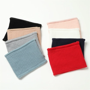 Macro view of multi-color waffle knit neck warmer scarves showing thick elastic texture