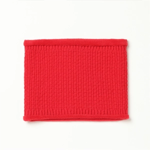 Macro shot of red waffle knit winter neck warmer with soft plush faux fur trim details