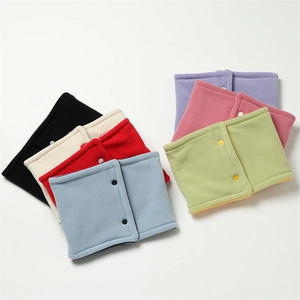 Flat lay of warm fleece neck warmers in various colors featuring metal snap buttons