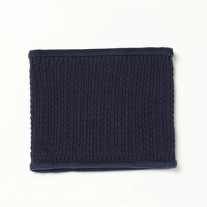 Close-up of navy blue ribbed knit neck warmer with plush faux fur trim for winter