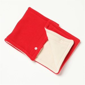 Detail of red fleece neck warmer with creamy white plush lining and white snap buttons