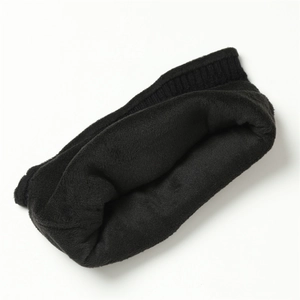 Close-up of black knitted neck warmer with thick soft plush lining for winter warmth