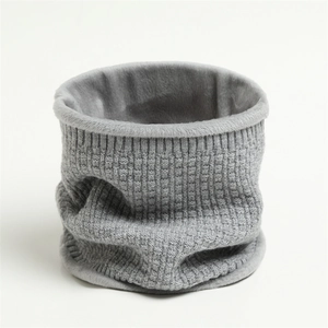 Close-up of grey waffle knit snood scarf featuring thick plush fleece lining for warmth