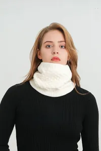 Detail of white knit neck warmer showing thick fleece lining and honeycomb texture