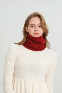 Detail of red knitted neck warmer featuring soft fleece lining for winter outdoor warmth