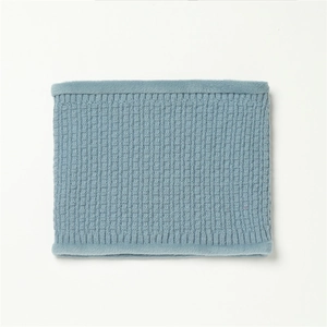 Close-up of fog blue knit neck warmer with fluffy faux fur edges for winter warmth