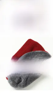 Detail of red knit scarf with thick grey fleece lining for cold weather warmth