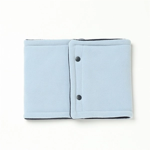 Close-up of light blue fleece neck warmer featuring dual grey snap buttons and soft texture