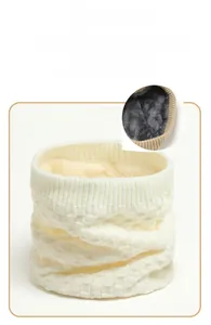 Close-up of cream knit neck warmer showing soft plush lining and thermal texture