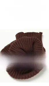 Macro shot of dark coffee ribbed knit neck warmer showing detailed vertical textures