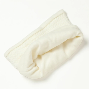 Close-up of white waffle knit scarf showing thick fleece lining for winter warmth