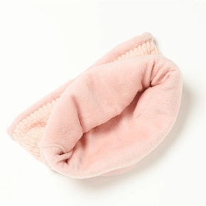 Detail of pink knitted neck warmer with thick plush lining for winter warmth