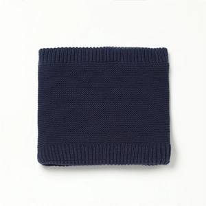 Detail view of navy blue knitted neck warmer showing ribbed edges and warm texture