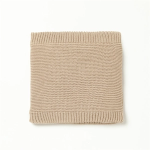 Detail of the thick knit texture and ribbed edges of the warm winter neck gaiter