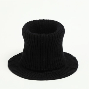 Close-up of the thick ribbed knit texture on a black winter neck warmer scarf