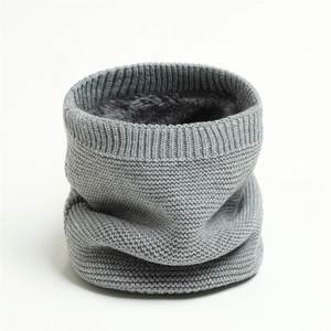 Detailed macro view of gray knitted neck gaiter with thick thermal fleece lining