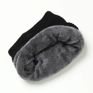Close-up of winter knit scarf with thick grey fleece lining for extra thermal warmth