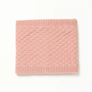 Detail of pink checkered knit neck warmer with ribbed edges for winter warmth